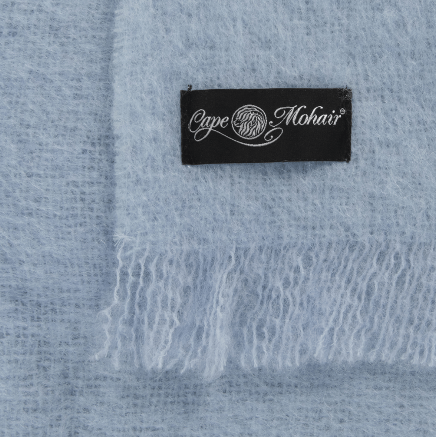 Cape Mohair logo on baby blue blanket
